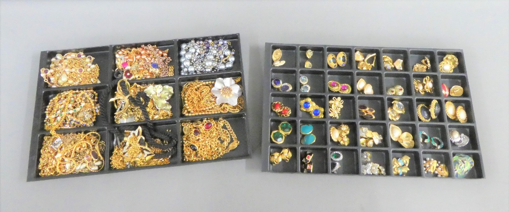 A large quantity of costume jewellery to include necklaces, brooches and clip on earrings, etc