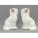 Pair of white glazed Staffordshire chimney spaniels, 26cm high (2)