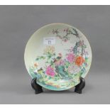 Chinese Famille Verte shallow bowl, painted with peacock, flowers, foliage and rock work, bearing
