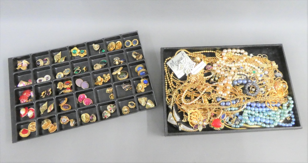 A large quantity of costume jewellery to include necklaces, brooches and clip on earrings, etc