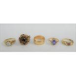 Four 9 carat gold gemset dress rings together with a 9 carat gold wedding band (5)