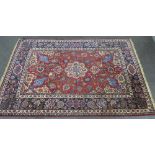 Isfahan style rug with a red field and allover foliate pattern, 140 x 220cm