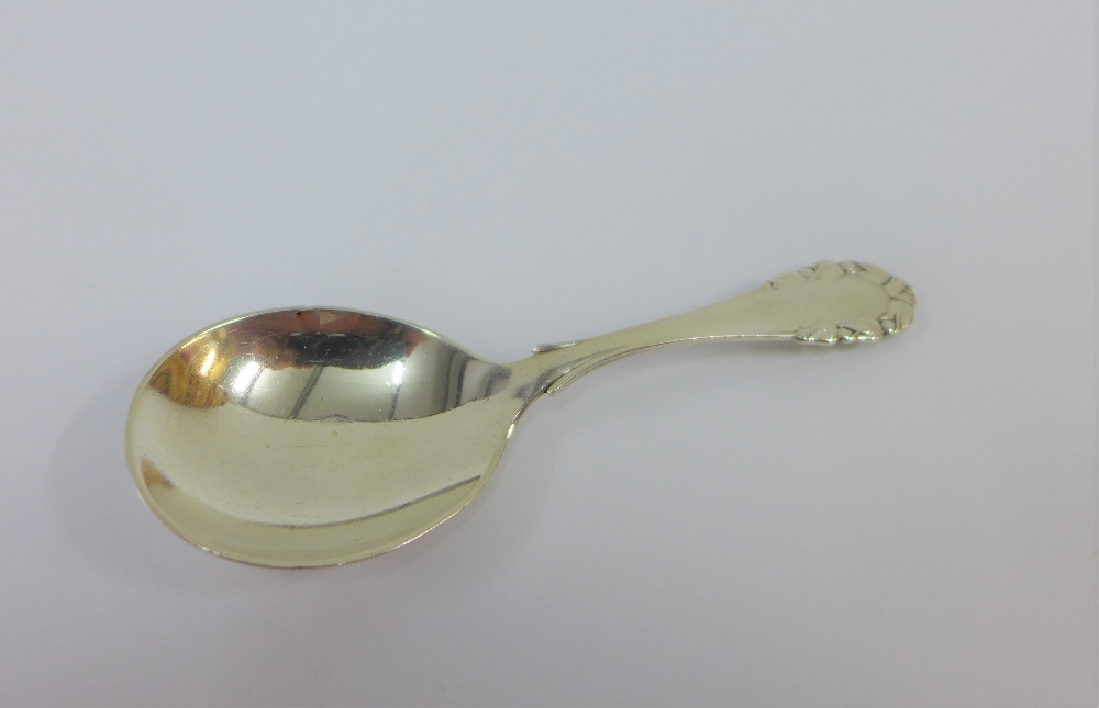 Georg Jensen, rose patterned silver caddy spoon, with London silver import hallmarks for 1928,