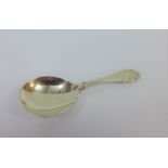 Georg Jensen, rose patterned silver caddy spoon, with London silver import hallmarks for 1928,