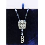 Carved jade pendant plaque on a string necklace with blue hardstone beads, plaque is 5 x 5cm