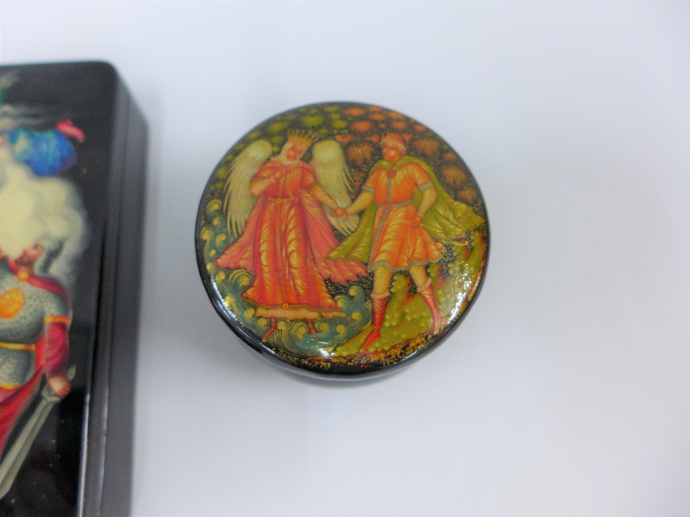 A collection of three Russian black lacquered boxes with painted lids, largest 13cm long (3) - Image 3 of 3