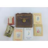 A miniature set of Beatrix Potter books, leather satchel and postcards, etc (a lot)