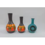 Two Dumler & Breiden West German retro vases together with a blue glazed bottle neck vase, tallest