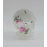 Meissen rose patterned cabinet cup and saucer, with blue crossed swords mark (2)