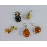 Five various silver and amber pendants (5)