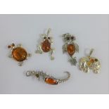 Five various silver and amber pendants (5)