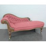 A Victorian mahogany framed button back chaise longue, with brass caps and ceramic castors, 190 x 88