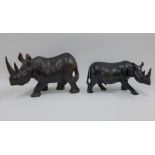 Two African hardwood Rhinos, 16cm high (2)