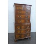 Mahogany chest on chest, the top with two short and three long drawers above pull out slides over