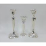 George V pair of silver candlesticks, Chester 1915 (weighted - one a/f) together with an Edwardian