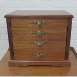 A collectors cabinet with four graduating long drawers, swing handles to side, 37 x 22cm