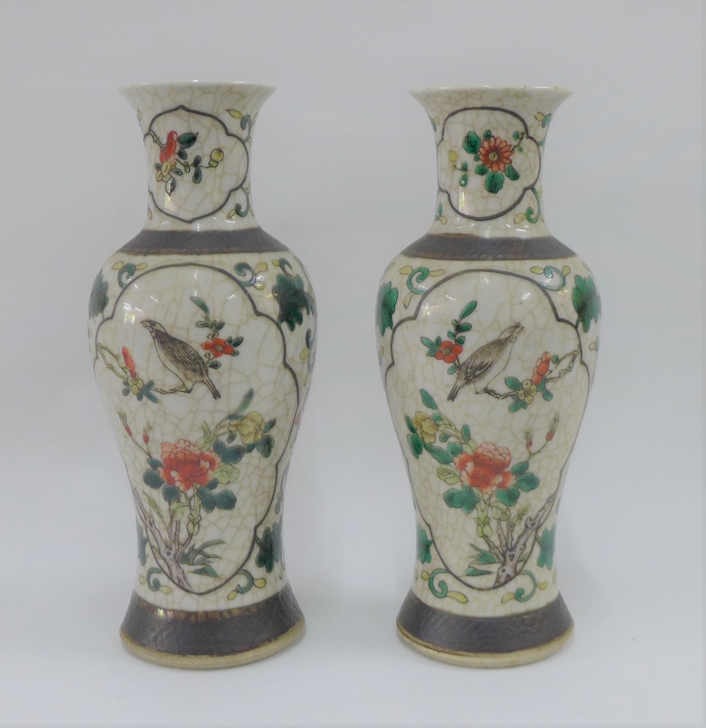 Pair of Chinese high shouldered baluster vases with bird and branch pattern to a craquelure ground