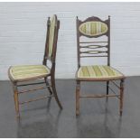 A pair of early 20th century mahogany and inlaid ladderback chairs with upholstered backs and