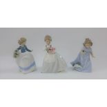 Three Nao porcelain girl figures, tallest 18cm