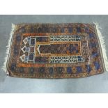 An Eastern Prayer rug with central mihrab panel, 88 x 145cm