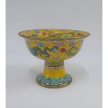 20th century yellow enamelled porcelain stem cup, in dragon pattern, with brass rims, 9 x 12cm (a/f)