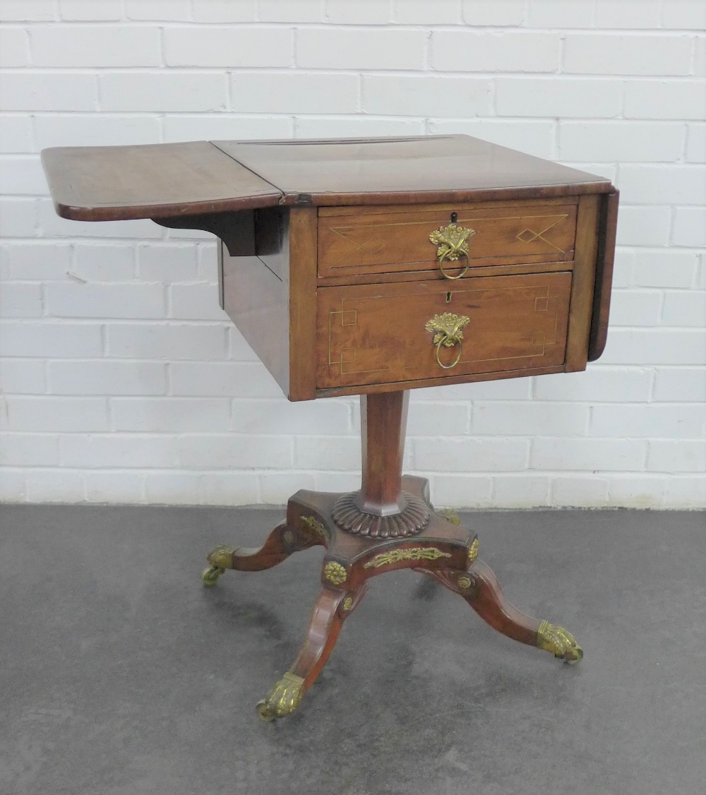 A mahogany table, the rectangular table with drop flaps, two frieze drawers and two dummy drawers,