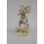 Early 20th century Japanese ivory Okimono of a Fisherman, signed to the base, 9cm high