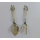 Danish silver fork and spoon set, with figure and deer terminals, 14cm long, (2)