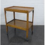 Early 20th century oak two tier trolley, on castors, 72 x 62cm