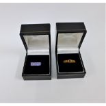 9 carat white gold tanzanite dress ring together with a 9 carat gold spinel dress ring (2)