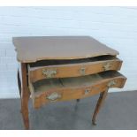 An oak lowboy style two drawer side table on cabriole legs, 71 x 46 x 78cm