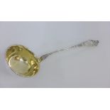 Early 20th century Continental silver gilt ladle, stamped 830S, 31cm long