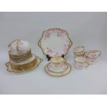 Late 19th / early 20th century porcelain teaset with pink floral sprays and gilt rims, (a lot)
