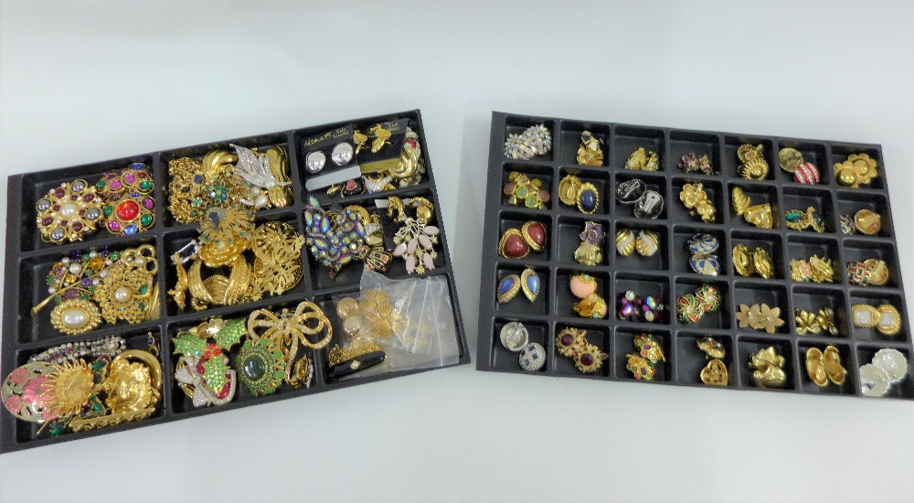 A large quantity of costume jewellery to include necklaces, brooches and clip on earrings, etc