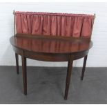 Mahogany demi lune serving table, with brass gallery rail and ledgeback, on square tapering