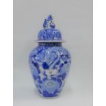 Chinese blue and white covered vase, the lid with temple lion finial, 34cm high