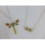 Two silver and amber pendant necklaces (2)