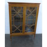 Mahogany bookcase, the rectangular top over a pair of astragal glazed doors with a shelved interior,