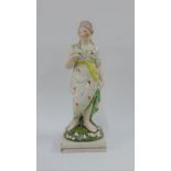 Late 18th / early 19th century Staffordshire pearlware figure of Venus, modelled standing holding