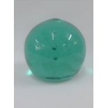 Large green glass paperweight dump, 14cm high