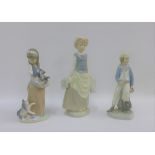 Three Lladro porcelain figures to include 'Water Carrier', etc, tallest 29cm (3)