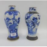 Two Chinese blue and white high shouldered baluster vases both with brown scratch border rims,