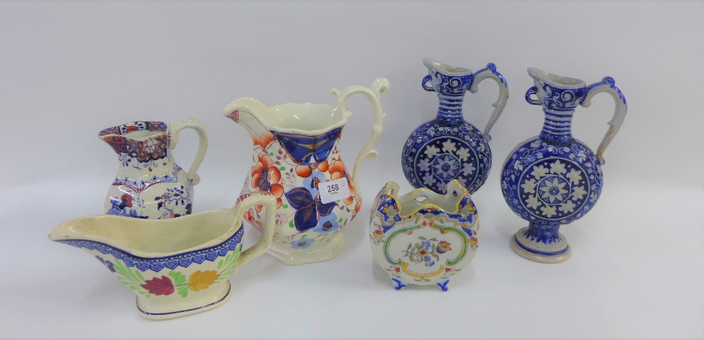 Masons style Imari jug, a pair of German stoneware ewers, Rouen faience miniature vase and two
