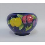 Moorcroft bowl the blue ground tubeline decorated with Wisteria Plums pattern, with facsimile signa