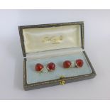 Gents carnelian cufflinks set in white metal which tests as 18 carat white gold, boxed