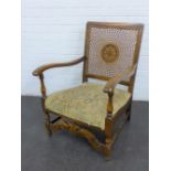 Early 20th century open armchair with Bergere caned back, upholstered seat and Carolean style