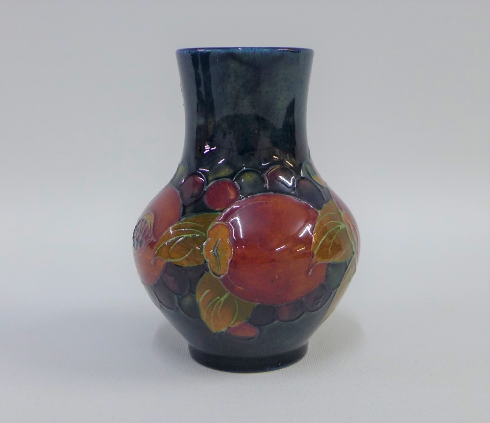 Moorcroft Pomegranate pattern vase with a blue ground, impressed facsimile signature and marks to