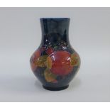 Moorcroft Pomegranate pattern vase with a blue ground, impressed facsimile signature and marks to