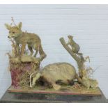 Taxidermy group of a fox, badger, squirrel, mole and rabbit, on a plinth base, 107 x 80 x 30cm