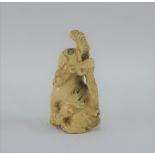 Ivory Netsuke in the form of a Temple Dog, signed, 5.5cm high